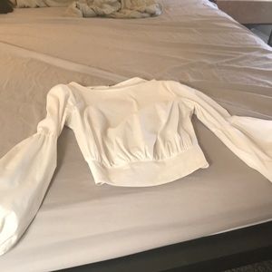 Beautiful Bebe top- with a stylish sleeve